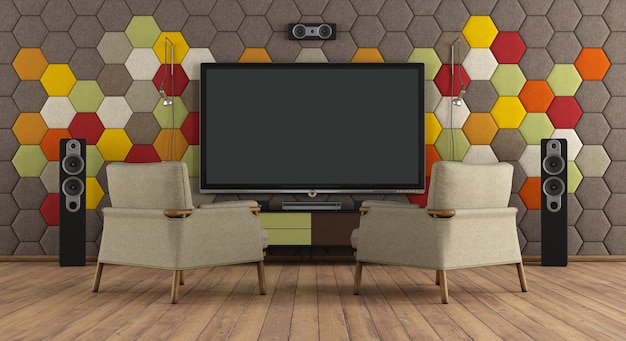 Foto interior moderno con sistema de cine en casa, dos sillones y paneles acústicos coloridos - representación 3d