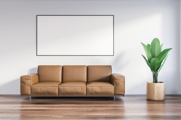 Interior de salón minimalista con paredes blancas, suelo de madera, sofá de cuero junto a una maceta y un afiche horizontal. maqueta de renderizado 3d