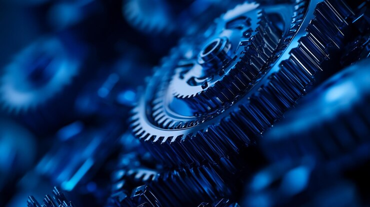 Intrincados engranajes azules entrelazados en un conjunto mecánico que muestra detalles de diseño industrial