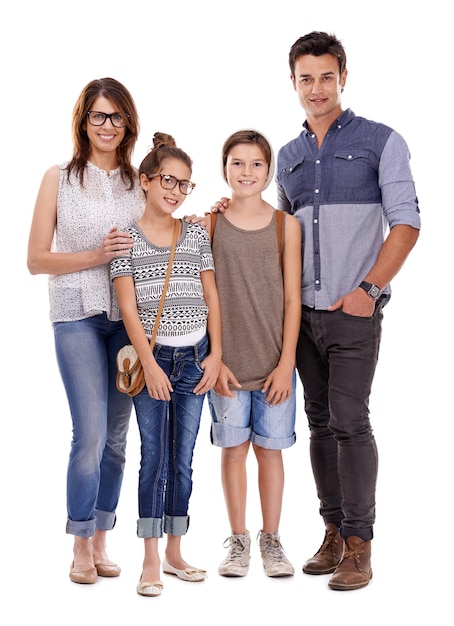 Ir a la moda o ir a casa Foto de estudio de la familia joven de moda contra un fondo blanco.