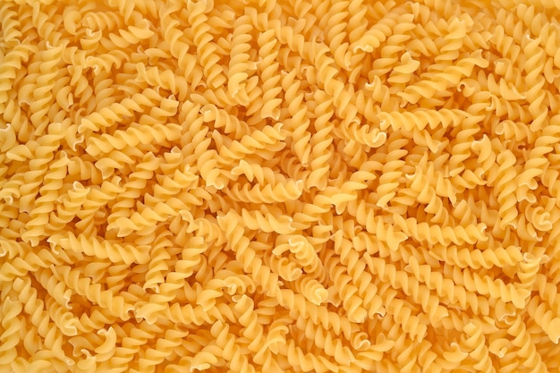 Italienischer Pasta-Fusilli-Hintergrund. Essen Hintergrundtextur.