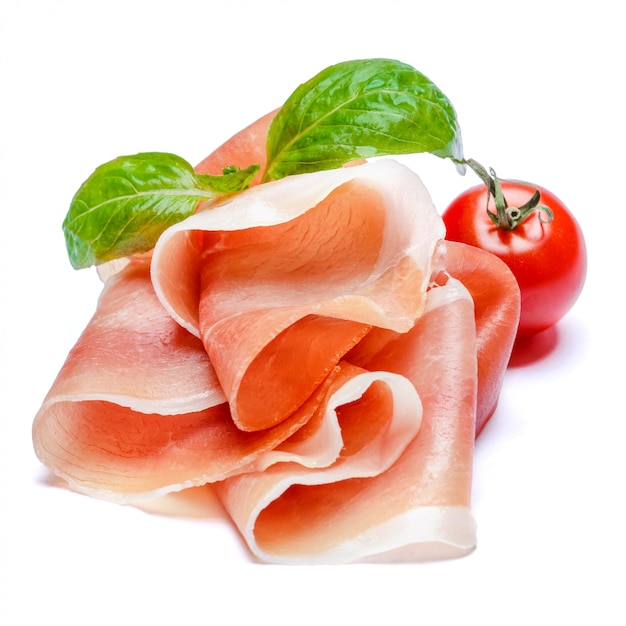 Italienischer Prosciutto Crudo oder spanischer Jamon und Tomaten. Roher Schinken