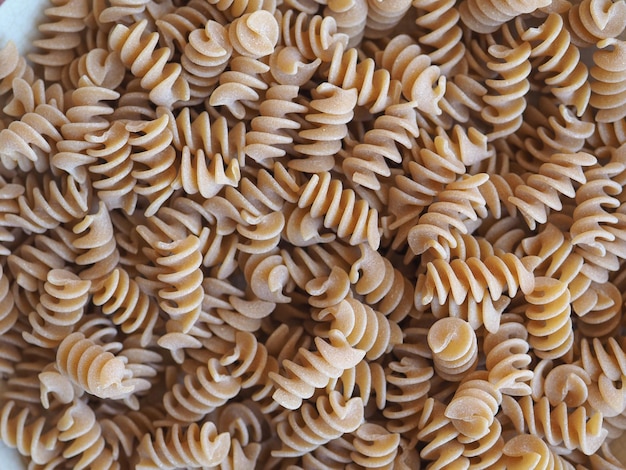 Italienischer Teigwarenhintergrund Fusilli