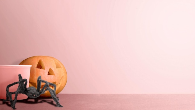 JackoLantern e aranha em um fundo colorido Conceito bonito de papel de parede de Halloween