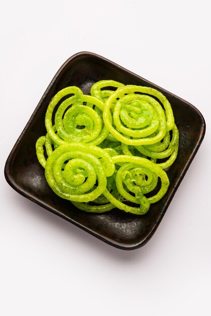 Foto jalebi mithai verde o dulce de la india un giro a un imarti o jilbi tradicional