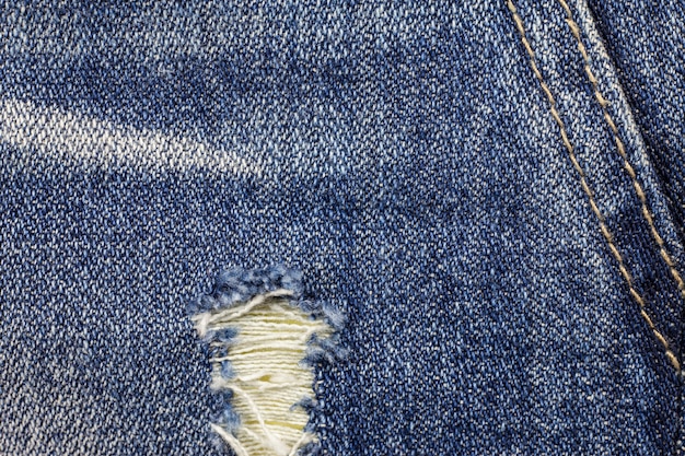 Jeans rasgados fondo de textura de mezclilla.