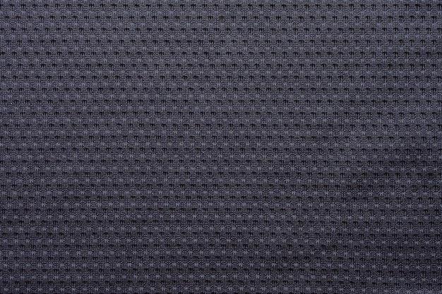 Foto jérsei de futebol de tecido preto para roupas esportivas com fundo de textura de malha de ar