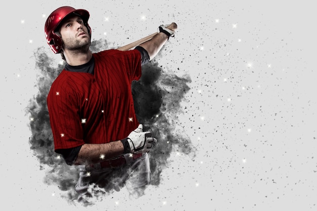 Jogador de beisebol com um uniforme vermelho saindo de uma rajada de fumaça.