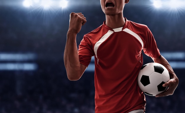 Jogador de futebol a celebrar