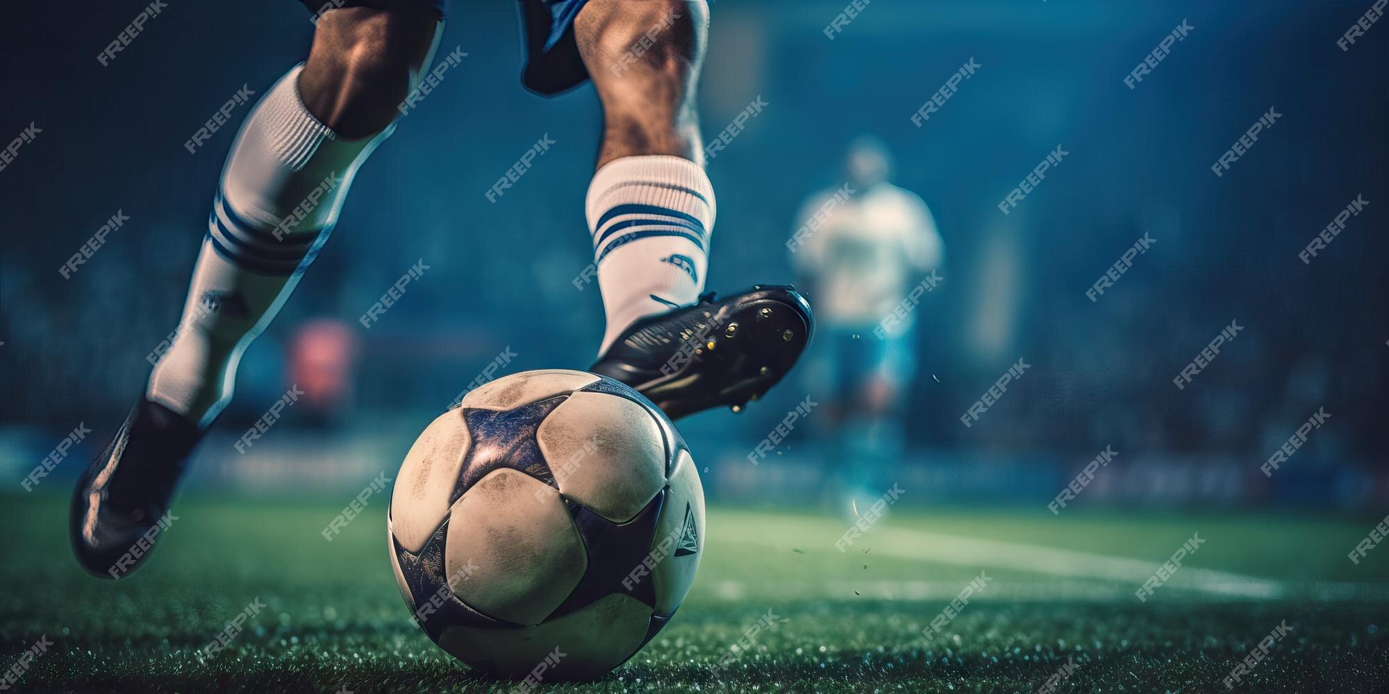 Jogador de futebol colocando a bola na grama ângulo baixo do