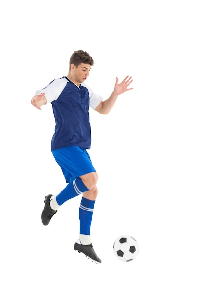 Jogador de futebol em bola azul