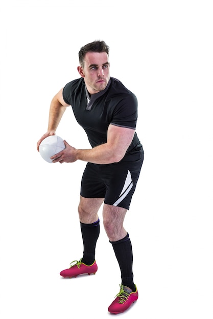 Foto jogador de rugby jogando a bola