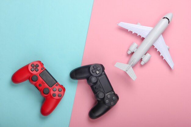 Jogo aéreo. gamepads, avião em um pastel rosa-azulado