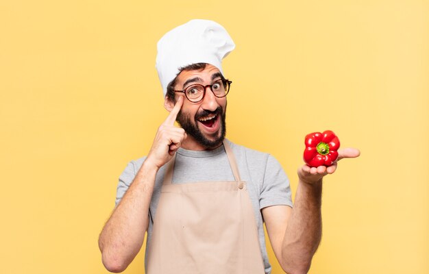 Jovem chef barbudo pensando em expressão