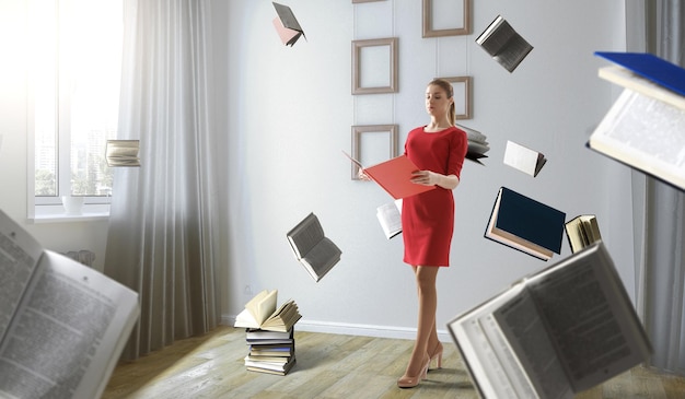 Jovem de vestido vermelho lendo um livro com outros livros voando ao redor. Mídia mista