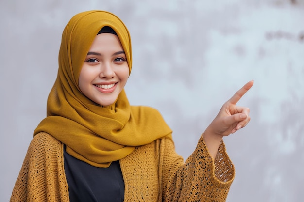 Foto jovem hijab mulher apontando