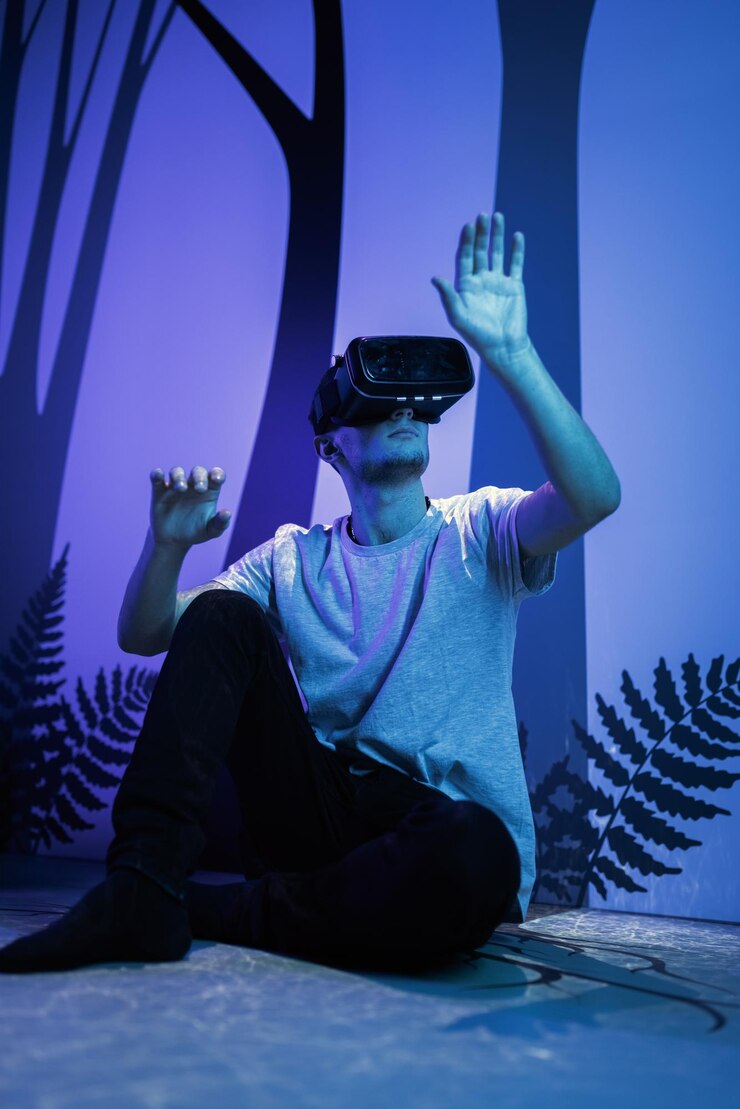 Foto jovem usando óculos vr sentado em uma pose de ioga na diversão do chão da sala de fuga de realidade virtual
