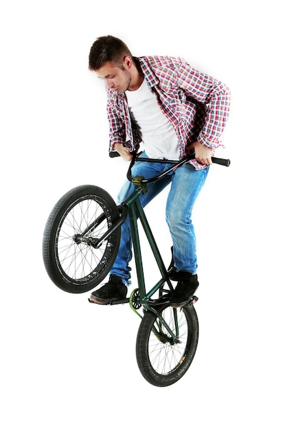 Foto joven en bicicleta bmx aislado en blanco