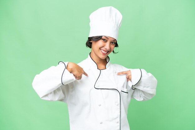 Joven chef argentina sobre un fondo aislado orgullosa y satisfecha