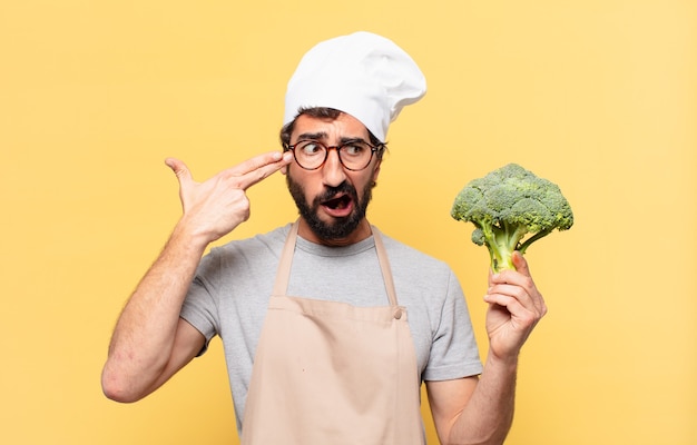 Joven chef barbudo hombre expresión triste