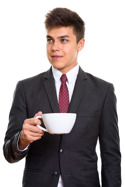 joven empresario guapo sosteniendo una taza de café