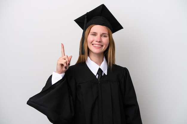 Joven graduada universitaria inglesa aislada de fondo blanco mostrando y levantando un dedo en señal de lo mejor