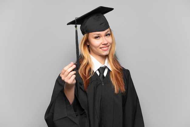 Joven graduada universitaria sobre antecedentes aislados haciendo gesto de dinero