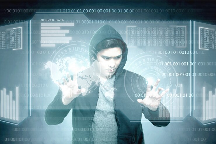Foto joven hacker asiático en negro con capucha tocando la pantalla virtual