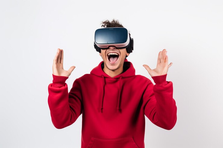 Joven hombre de negocios feliz de pie en el estudio con gafas de realidad virtual 3D aislado sobre b blanco