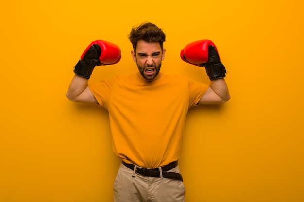 Joven, llevando, guantes de boxeo