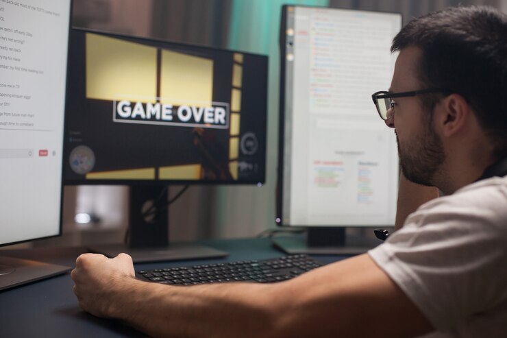 Foto joven manteniendo el puño apretado después de perder en juegos de disparos en línea. se acabó el juego para los jugadores.