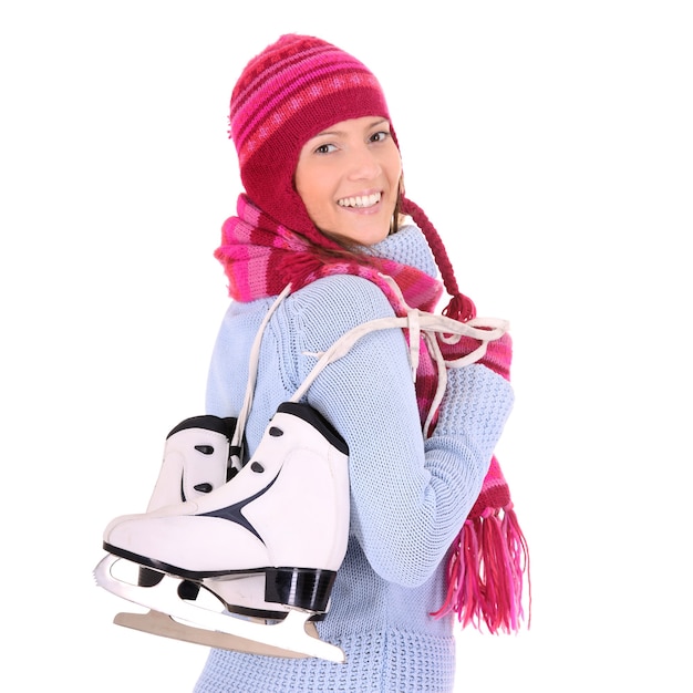 Una joven mujer feliz con sus patines sobre blanco