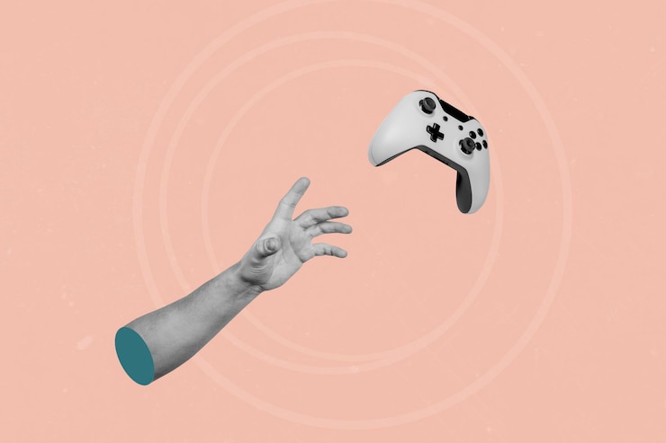 Foto joystick de juego volador de captura manual sobre fondo rosa abstracto creativo