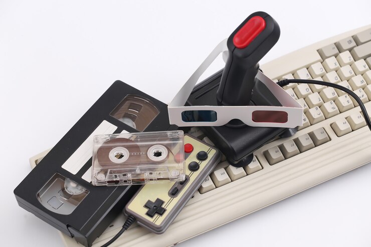 Foto joystick retro, gamepad com óculos 3d, cassete de áudio e vídeo, teclado antigo em um fundo branco. atributos anos 80