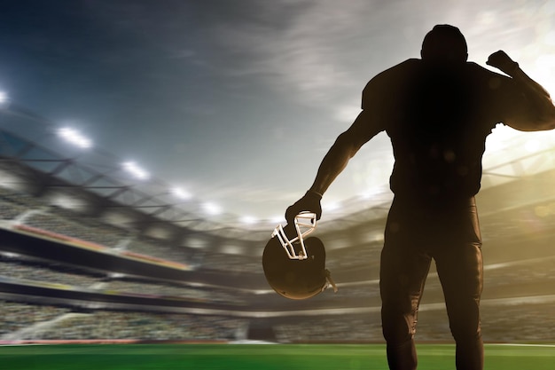 Un jugador de fútbol con casco frente a un estadio