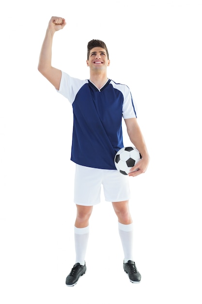 Foto jugador de fútbol en celebración azul