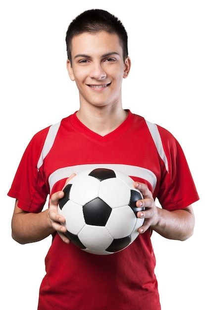 Foto jugador de fútbol masculino joven sobre fondo blanco.