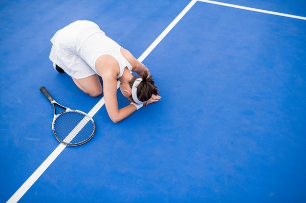 Jugadora de tenis agotada