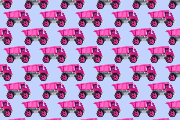 Juguete de coche de camión volcado de plástico rosa colorido aislado sobre fondo azul naturaleza muerta patrón sin fisuras plantilla de maqueta juguetes para niños niñas niños desarrollo jugando infancia