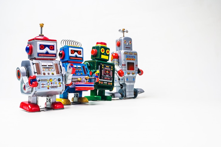 Foto juguete de estaño robot sobre fondo blanco