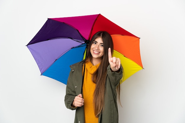 Junge Frau, die einen Regenschirm hält