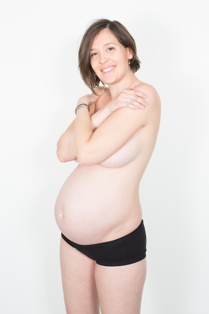 Junge glückliche schwangere Frau Konzept glückliche Mutterschaft