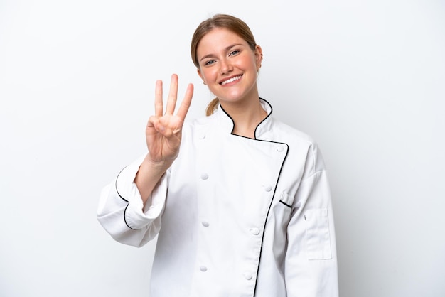 Junge Kochfrau lokalisiert auf weißem Hintergrund glücklich und zählt drei mit den Fingern