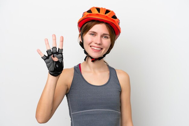 Foto junge radfahrerin engländerin isoliert auf weißem hintergrund glücklich und vier mit den fingern zählend