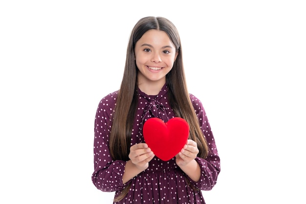 Junge Teenager Kind Mädchen mit Herzform Happy Valentines Day Liebe und angenehme Gefühle Konzept Porträt von glücklich lächelnden Teenager-Mädchen