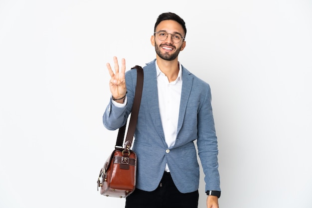 Junger kaukasischer Geschäftsmann lokalisiert auf weißem Hintergrund glücklich und zählt drei mit den Fingern
