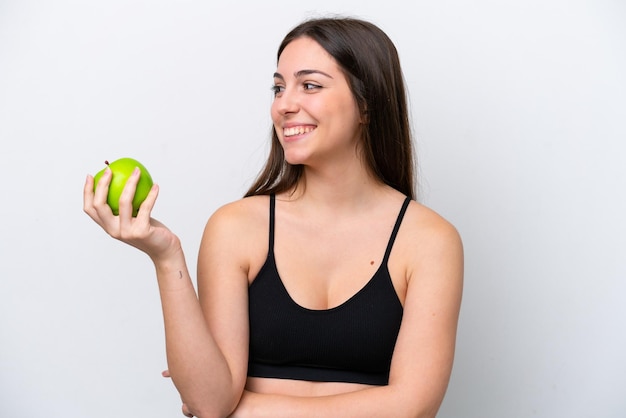 Junges Mädchen getrennt auf weißem Hintergrund mit einem Apfel und glücklich