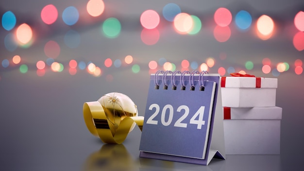 Kalender von 2024 mit verschwommenem Lichthintergrund Glückliches neues Jahr 2024