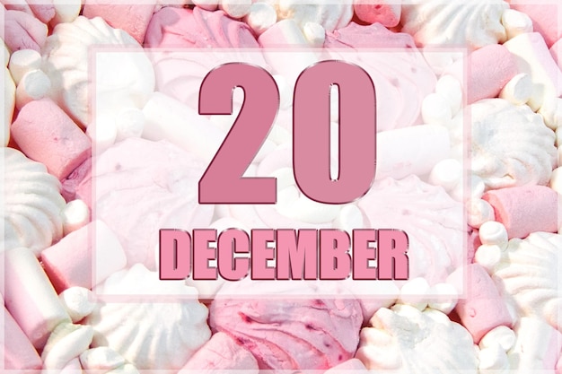 Kalenderdatum auf dem Hintergrund von weißen und rosa Marshmallows Der 20. Dezember ist der zwanzigste Tag des Monats