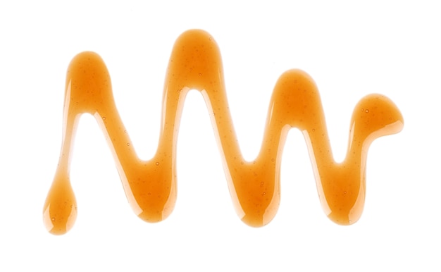 Karamellsirupnieselregen isoliert auf Weiß